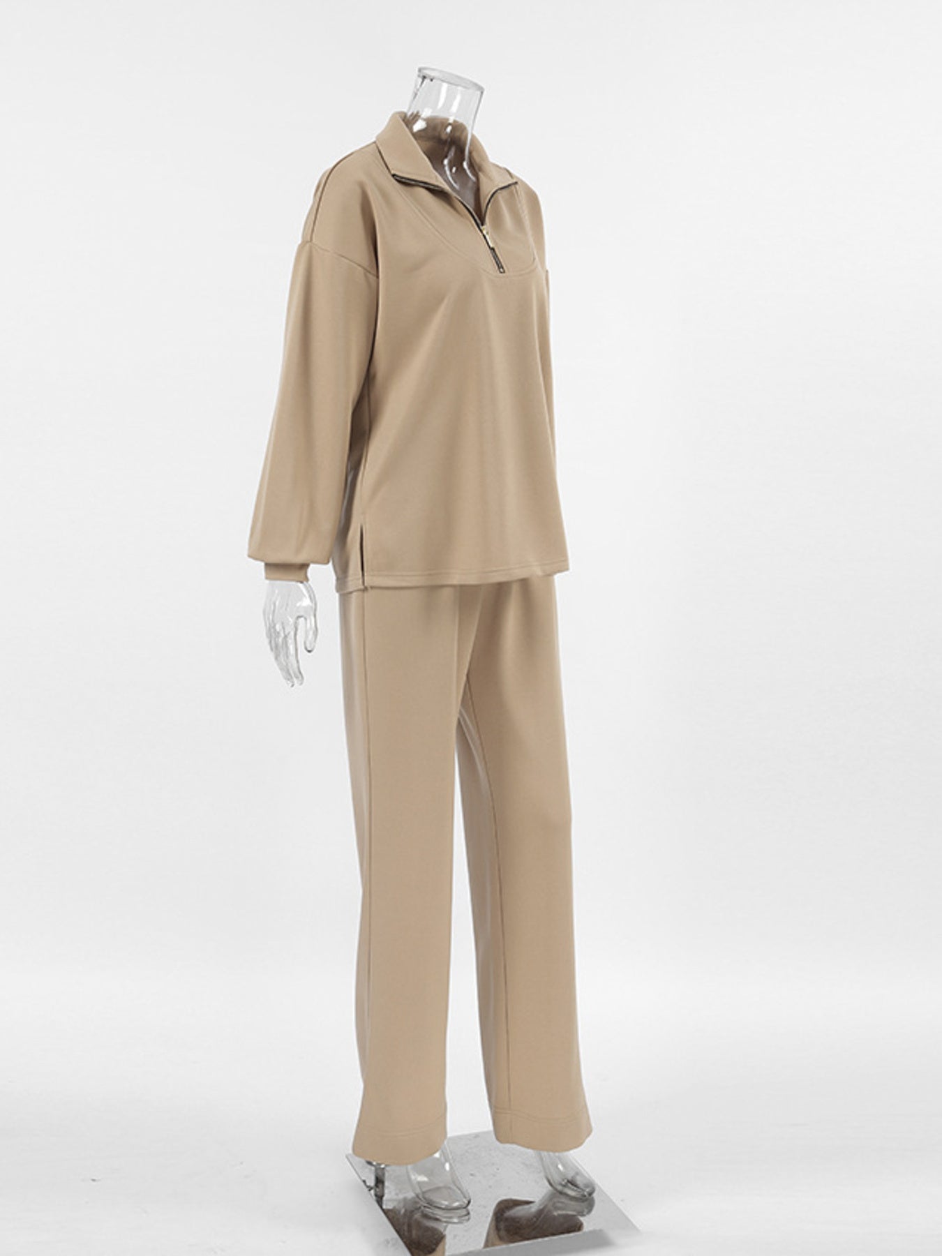 Camel quarter zip top and matching pants set with a relaxed fit.