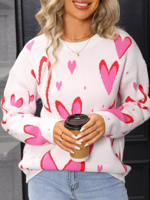 White acrylic crew neck sweater with pink and red heart pattern
