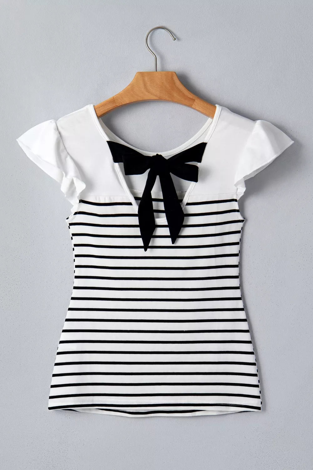 Chic striped tank top with ruffled sleeves and a black knot back detail.
