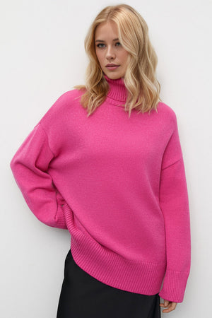 Oversized hot pink turtleneck knit sweater with ribbed cuffs and hem.