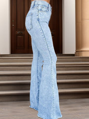Light blue acid wash flare jeans with a buttoned waist and frayed hem.