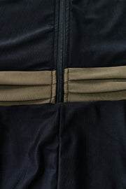 Black sporty legging swimsuit with ruched detail and zip closure