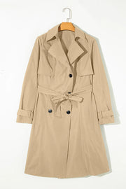 Classic trench coat in Dust Storm with a bow-tie waist and buttoned front.