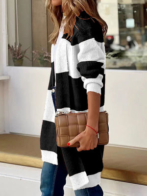 Colorblock ribbed open-front cardigan in black and white with long sleeves.