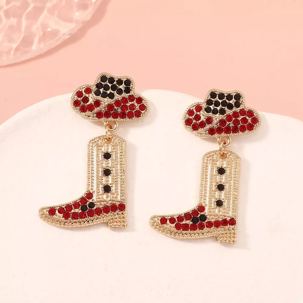 Red and black rhinestone cowboy boot dangle earrings with hat detail.