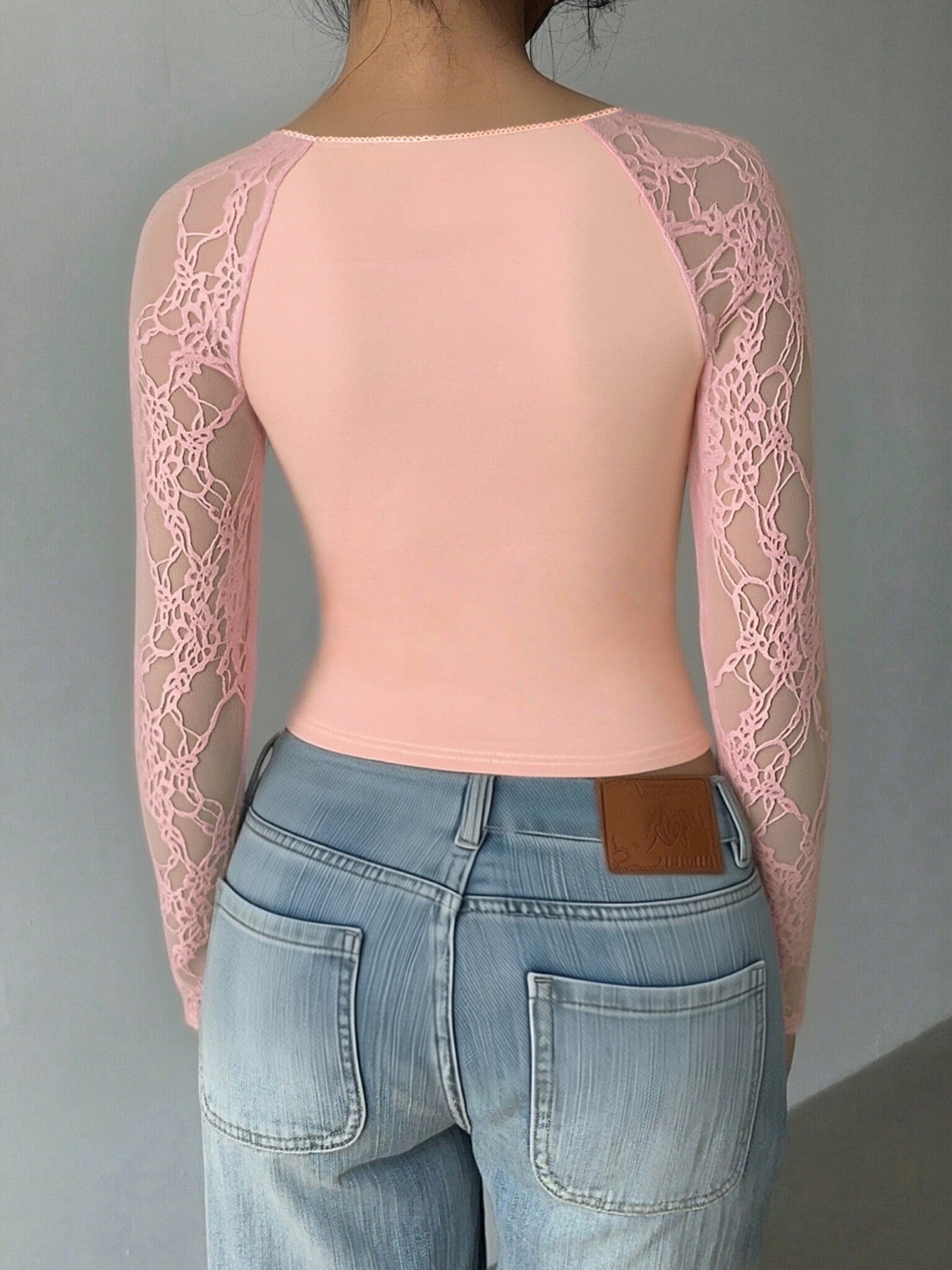 Blush lace sleeve square neck shirt with a cropped fit.
