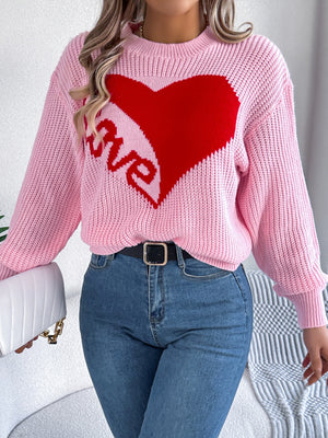 Pink knit sweater with red heart and love graphic, crewneck, long sleeves.