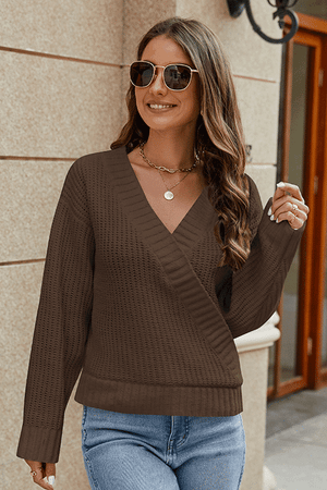 Brown wrap knit v-neck pullover sweater with a textured knit and relaxed fit.