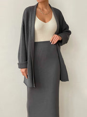 Dark gray ribbed knit cardigan and midi skirt set with a cream ribbed knit tank top.