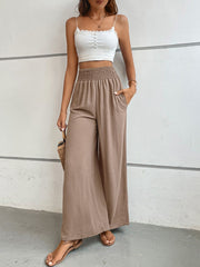 Brown textured smocked waist palazzo maternity pants with pockets.