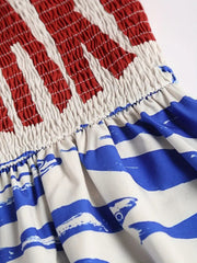 Sardine graphic spaghetti strap midi dress with smocked bodice and blue & white striped skirt.