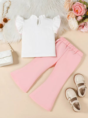 Baby pink flare pants and white ruffled top set with pink trim.
