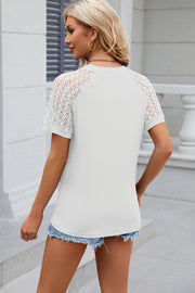 White ribbed tee with lace raglan sleeves and a crew neck.