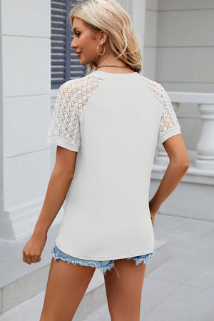 White ribbed tee with lace raglan sleeves and a crew neck.