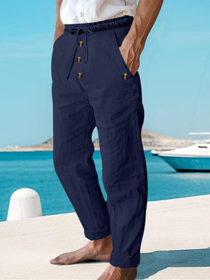 Navy blue cotton sweatpants with drawstring and button-fly detail.