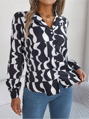 Black abstract wave print silk-touch blouse with button front and collar.