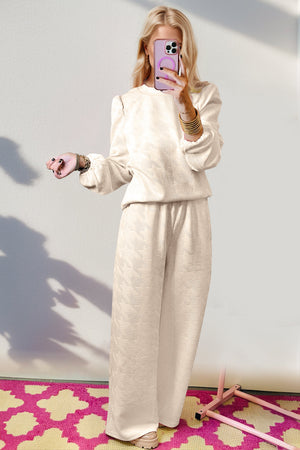 Cream chevron knit lounge set with puff sleeves and wide-leg pants.
