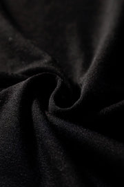 Black wide-leg jumpsuit with keyhole cutout detail and textured fabric.