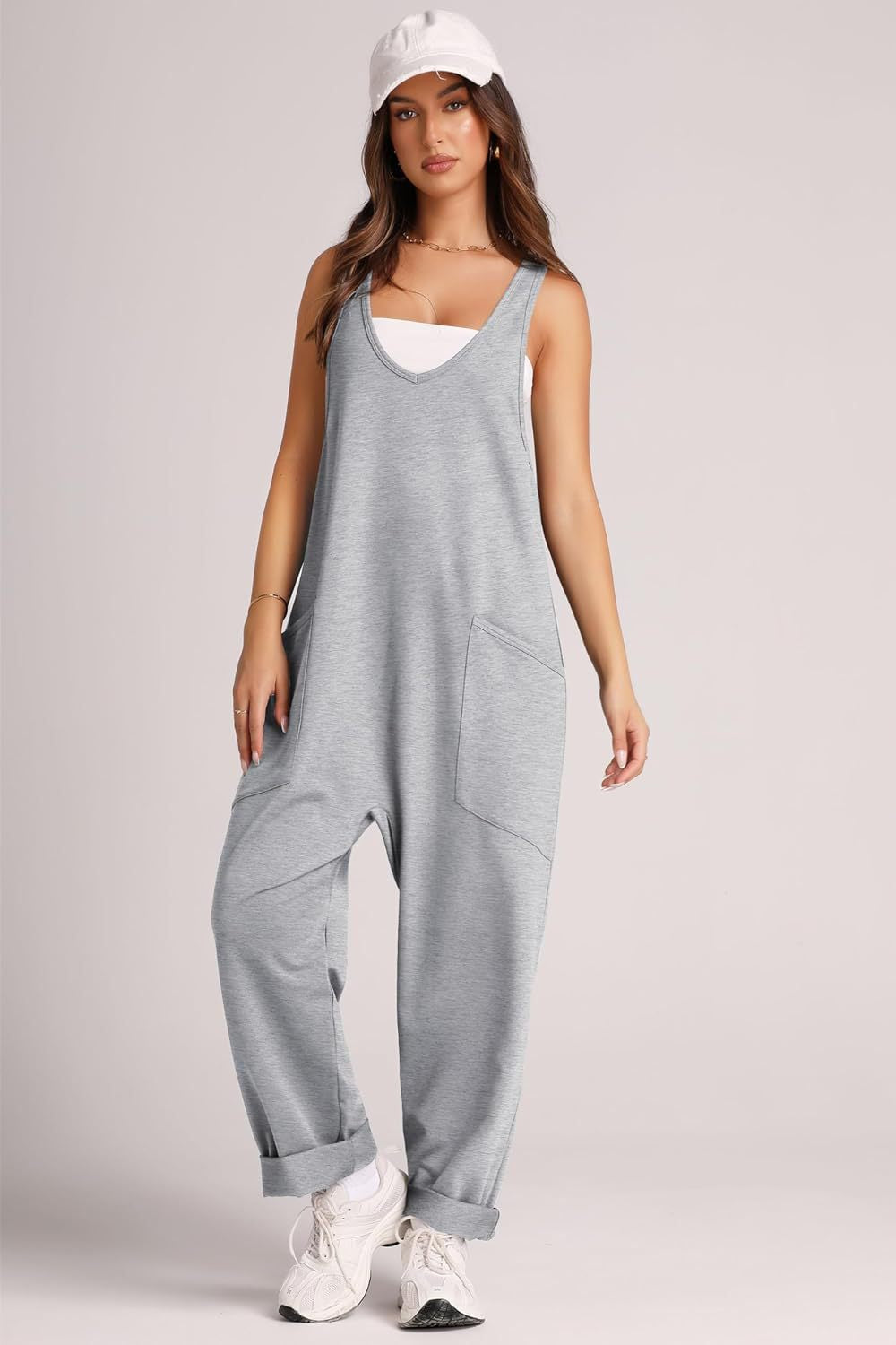 Relaxed fit light gray tank jumpsuit with deep pockets and cuffed ankles.