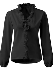 Black blouse with cascading ruffle front and balloon sleeves.