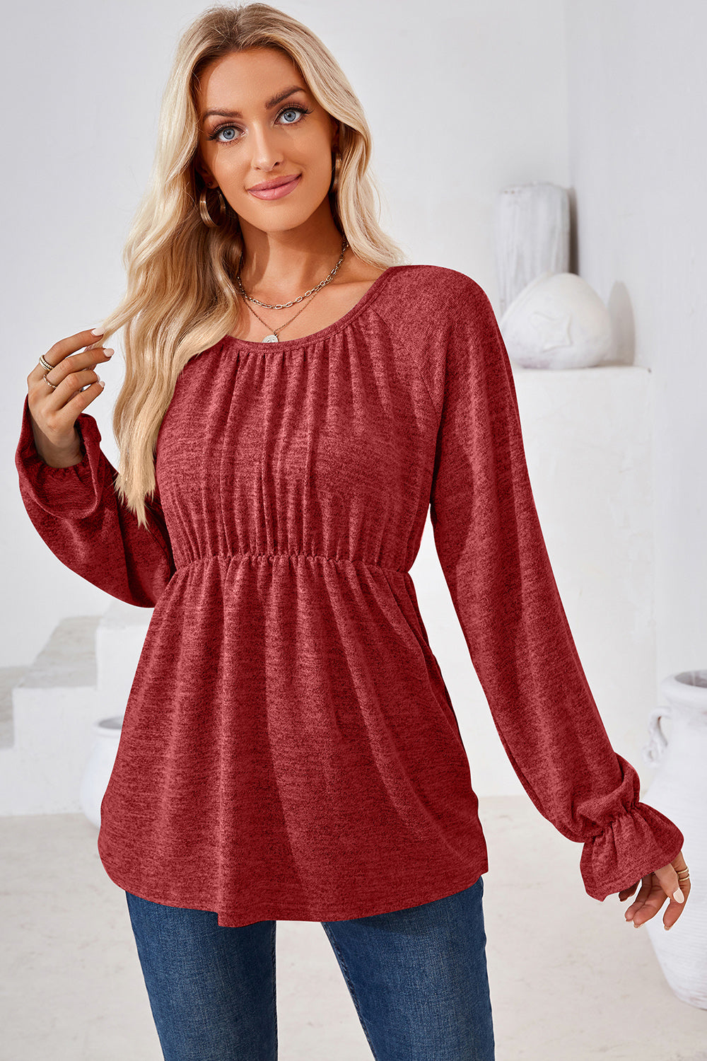 Burgundy long sleeve blouse with gathered neckline and elastic waist, ruffled cuffs
