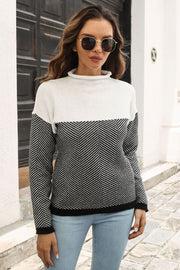 Chevron block mock neck knit sweater in black and white acrylic with a chevron pattern.