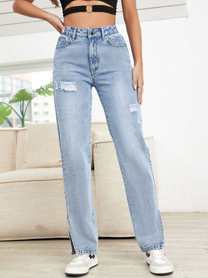 Light wash denim straight leg jeans with distressed details and slit hems.