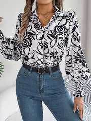 White floral print blouse with button front and shirred cuffs