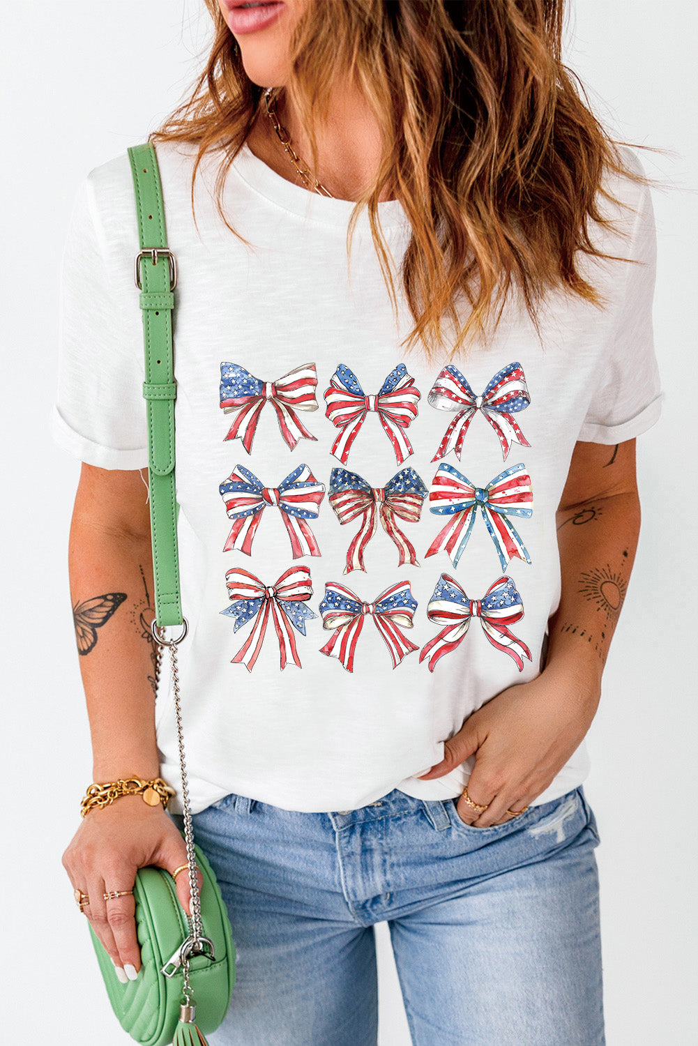 White t-shirt with patriotic bow print, crew neck, short sleeves, casual fit.