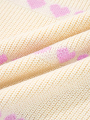 Cream knit sweater with pink heart pattern, acrylic blend fabric detail