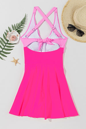 Hot pink one-piece swimsuit with cross-front and bow back detail
