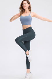 Deep Teal leggings with contrasting side panels and mesh details.
