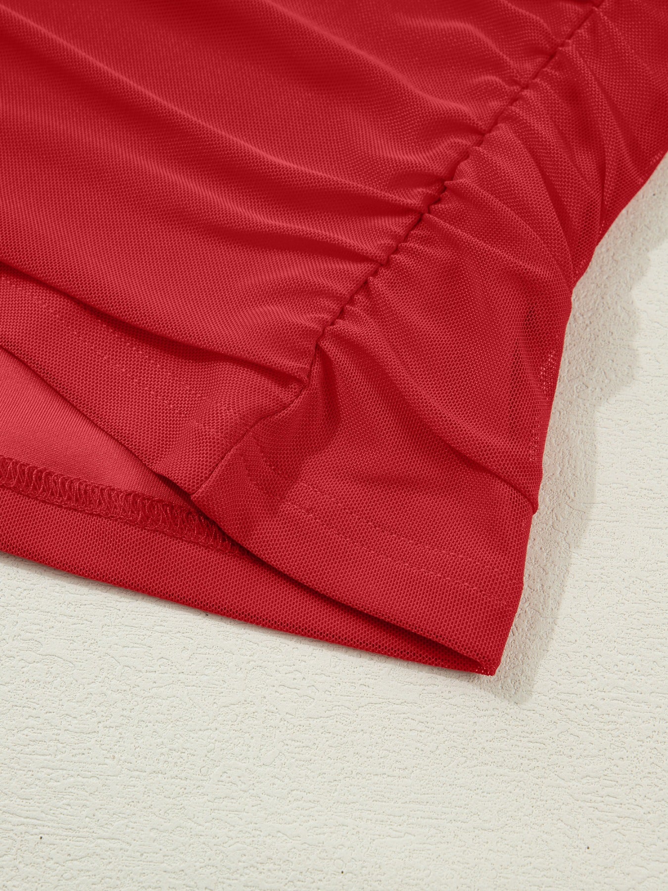 Deep red sheer mesh maternity blouse with ruched detail and long sleeves.