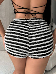 Textured stripe bouclé shorts in black with a fuzzy white stripe pattern and frayed hem.