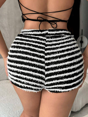 Textured stripe bouclé shorts in black with a fuzzy white stripe pattern and frayed hem.