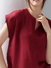 Red cap sleeve shirt with notched neckline, relaxed fit.