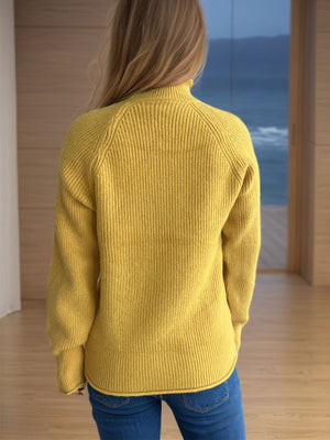 Yellow ribbed turtleneck sweater with raglan sleeves and a casual fit.