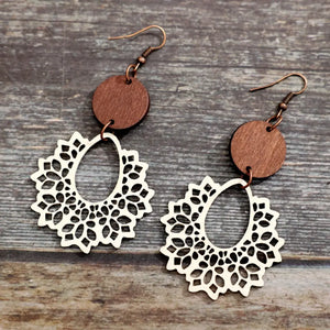 Floral laser-cut wooden drop earrings in ivory with tan wood accents.