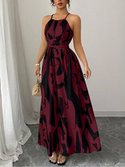 Burgundy abstract print halter neck maxi dress with a tie waist