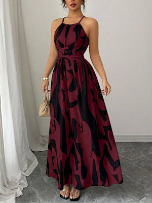 Burgundy abstract print halter neck maxi dress with a tie waist
