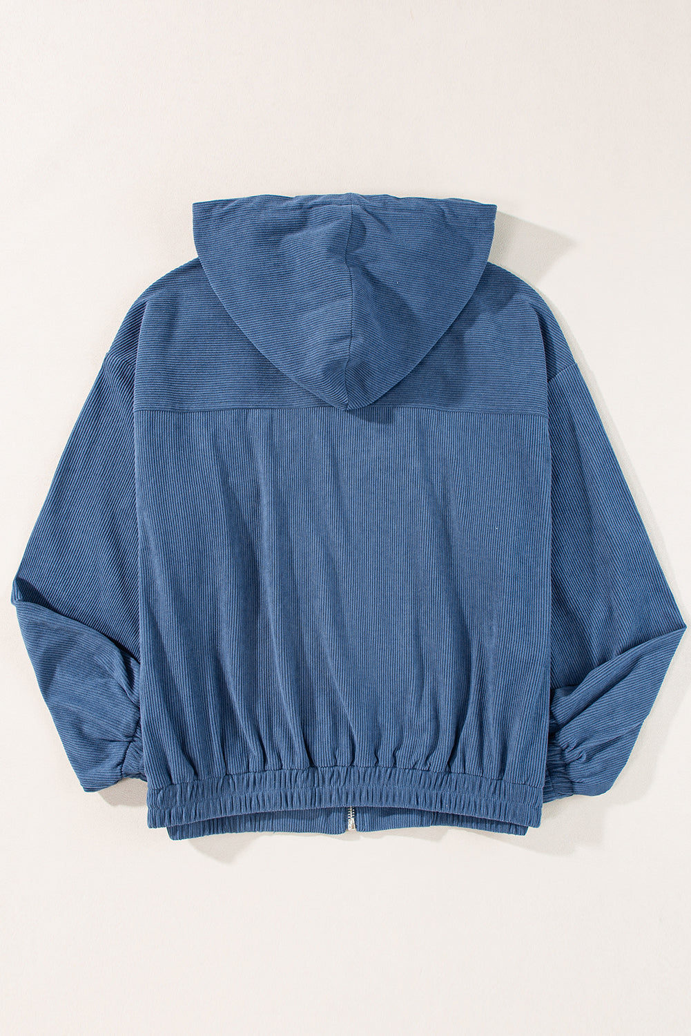 Dusty blue corduroy bomber hoodie with relaxed fit and elasticated cuffs and hem.
