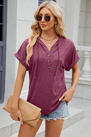 Henley hooded tee in Red-Violet with rolled short sleeves and button placket.