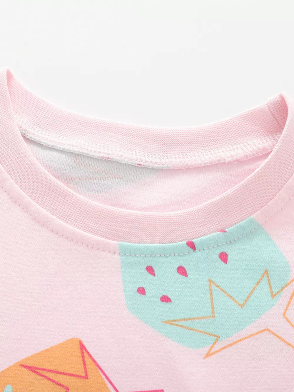 Pink cotton blend toddler t-shirt with playful strawberry print and crew neck.