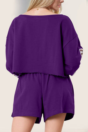 Violet cropped sweatshirt set with raw hem and embroidered sleeve detail.