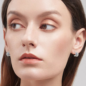 Silver triple-bar stud earrings with blue crystals, D color grade, for women.