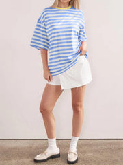 Oversized striped tee in light blue and white with dropped sleeves and a yellow neckline.