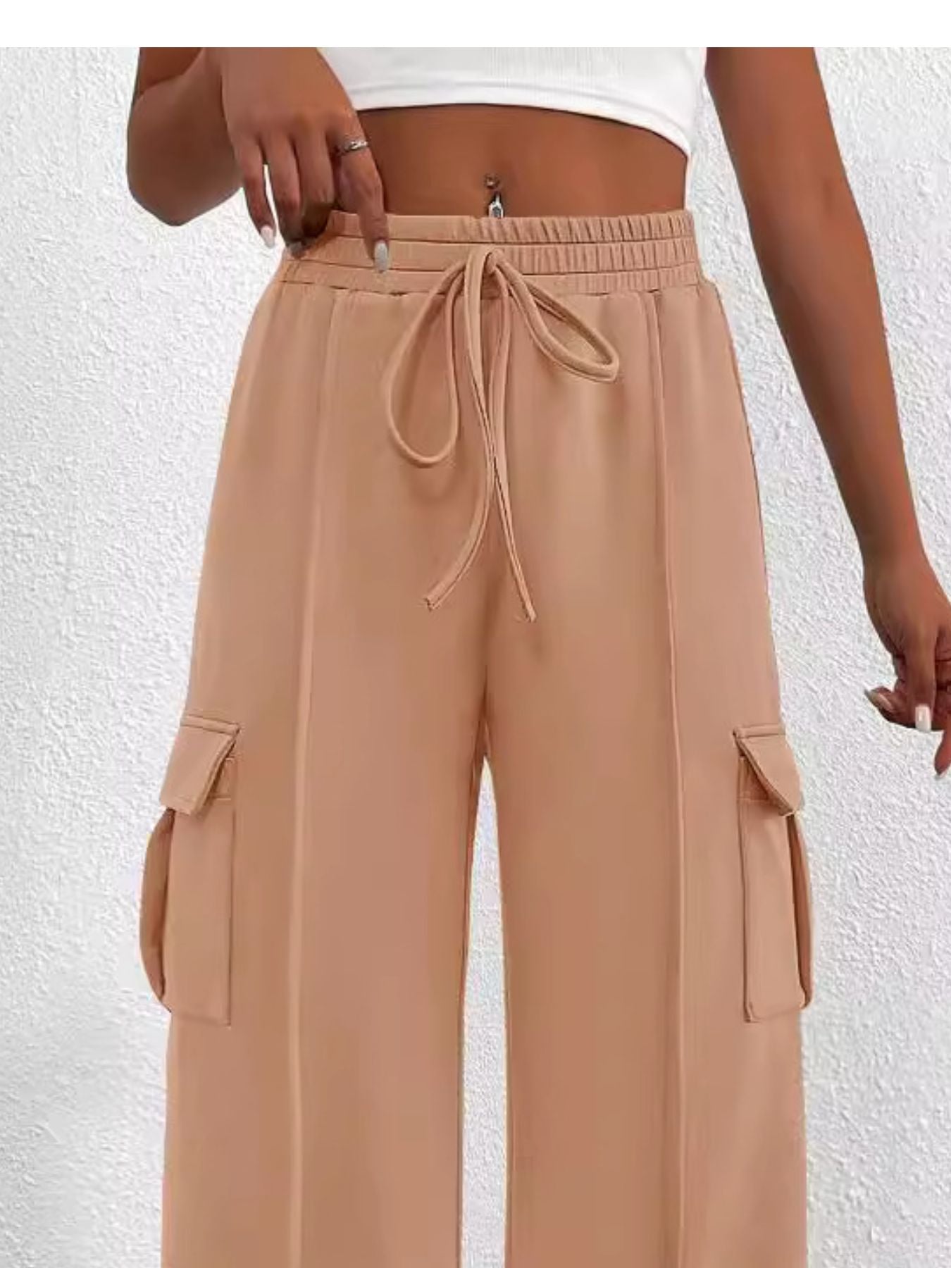 Apricot high waist cargo pants with drawstring and side pockets.