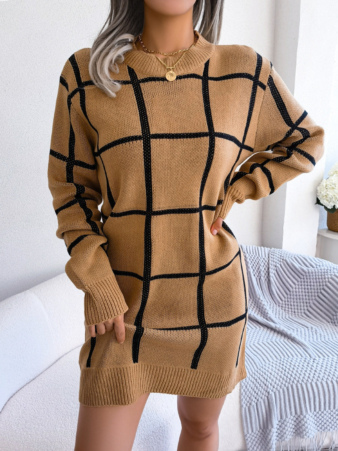 Geometric grid knit mini dress in khaki with long sleeves and crew neck.