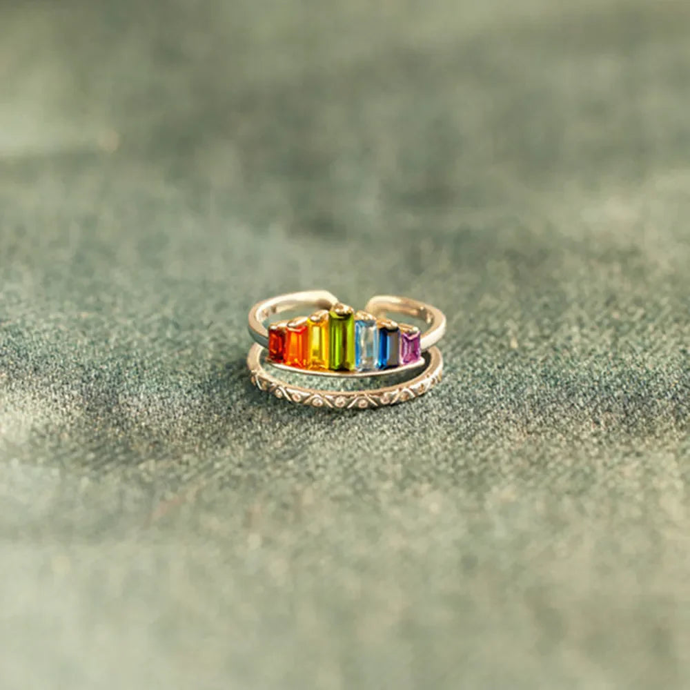 Rainbow prism stacked sterling ring set with colorful baguette gems and textured band