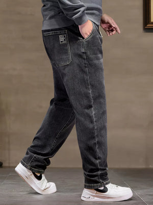 Black 100% cotton jeans with drawstring waist and back pocket detail.
